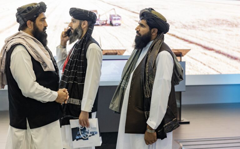 Image of three Taliban state officials